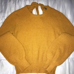I’m selling an orange sweater from Charlotte Russe